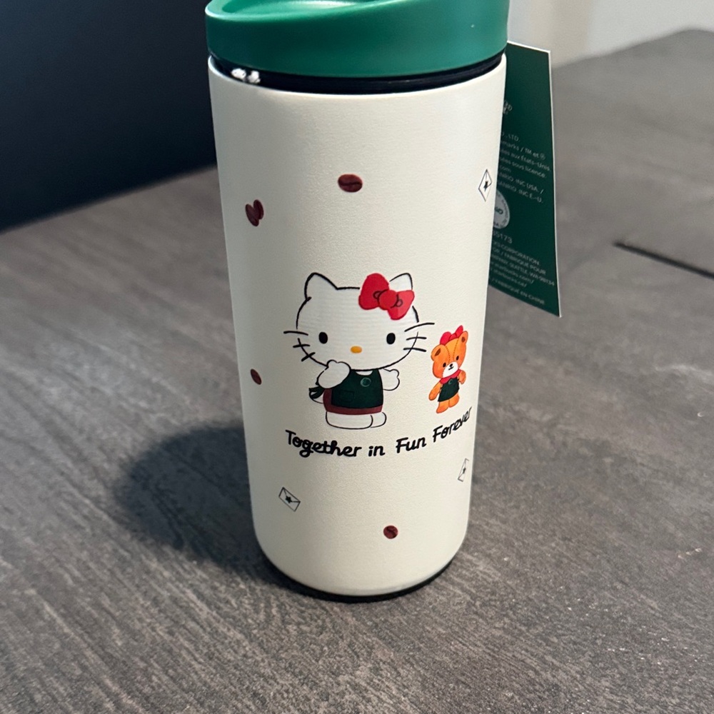 Starbucks Hello Kitty Travel Mug with Green Lid